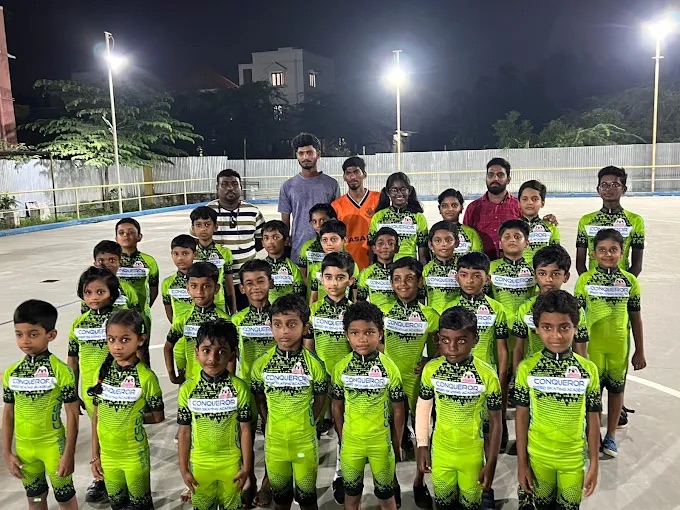 Conqueror students and coaches in their green team skating kit